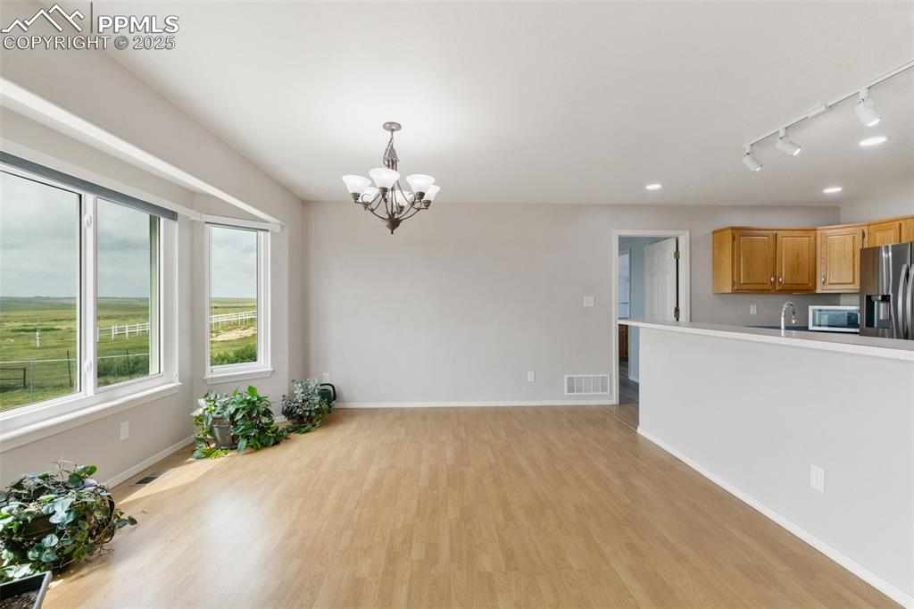 Image 10 of 50: Dining Room/Kitchen Combo