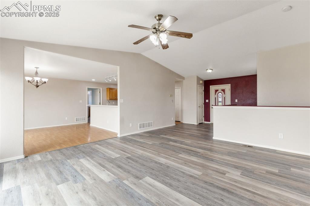 Image 9 of 50: Living Room Flows into Kitchen/Dining Room