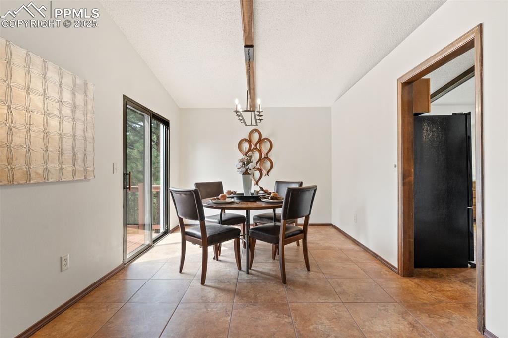 Image 13 of 32: Separate dining room with walkout balcony