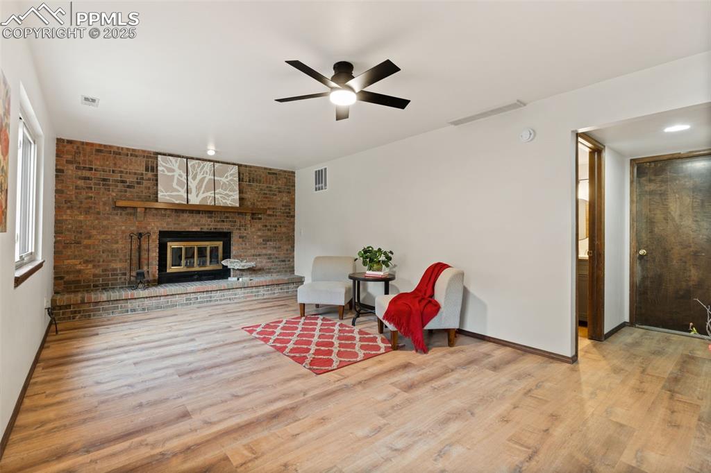 Image 19 of 32: Fireplace with wall to wall brick