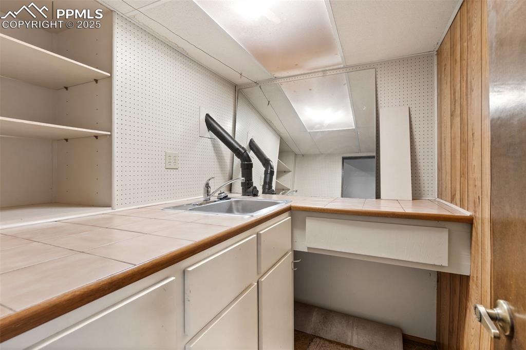 Image 28 of 32: Work space in the basement