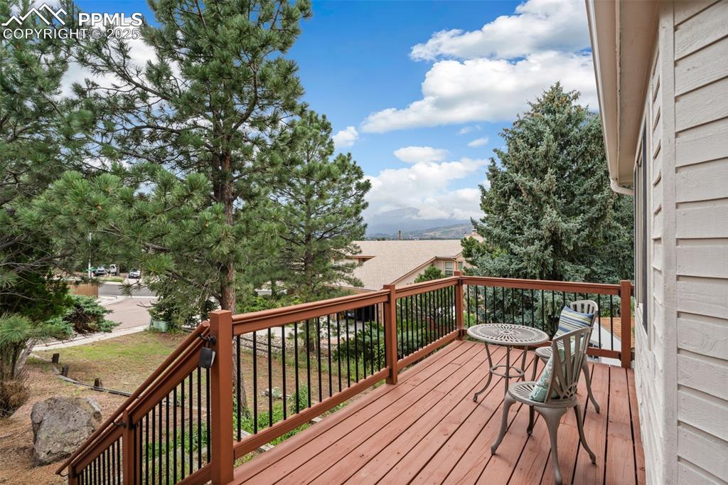 Image 29 of 32: Front deck with mountain views