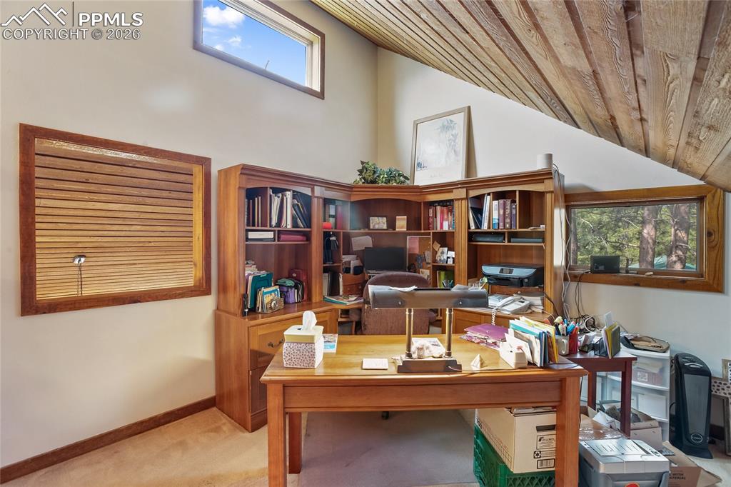 Image 17 of 39: Office with wood ceiling, wooden lofted ceiling!