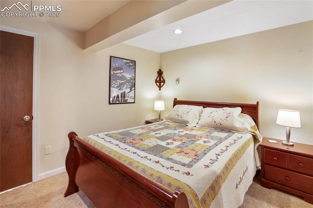 Image 22 of 39: Bedroom with carpet and recessed can lighting