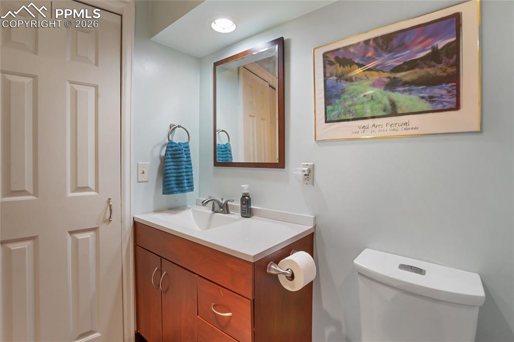 Image 24 of 39: 3/4 bathroom featuring vanity and toilet!