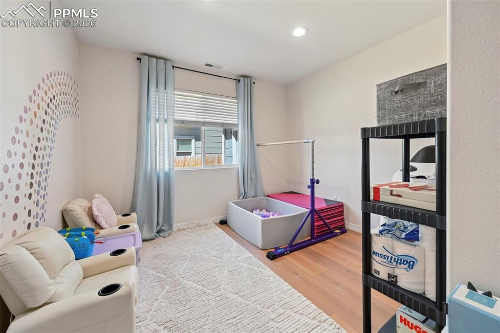 Image 17 of 45: This room features a window, and recessed lighting