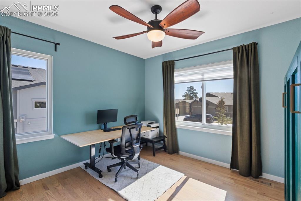 Image 19 of 44: Main level secondary bedroom that can be used as a home office as well!