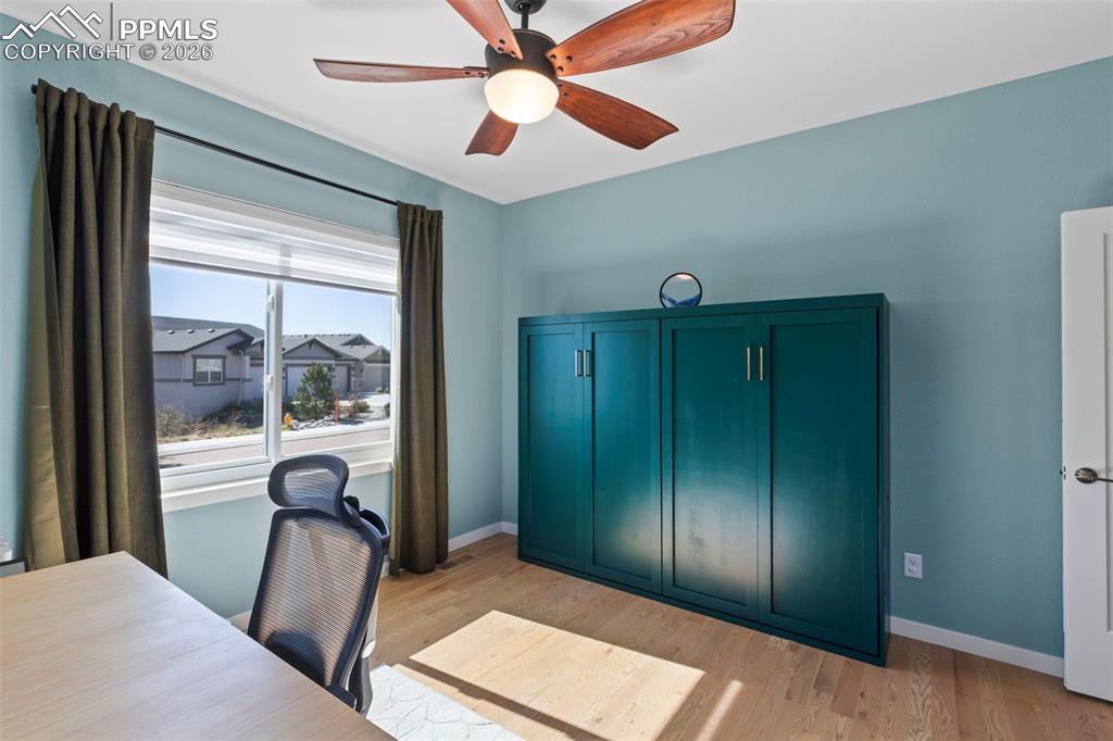 Image 20 of 44: Main level secondary bedroom that can be used as a home office as well!