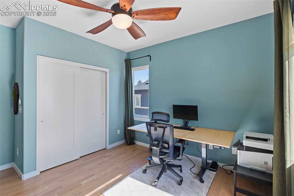Image 21 of 44: Main level secondary bedroom that can be used as a home office as well!