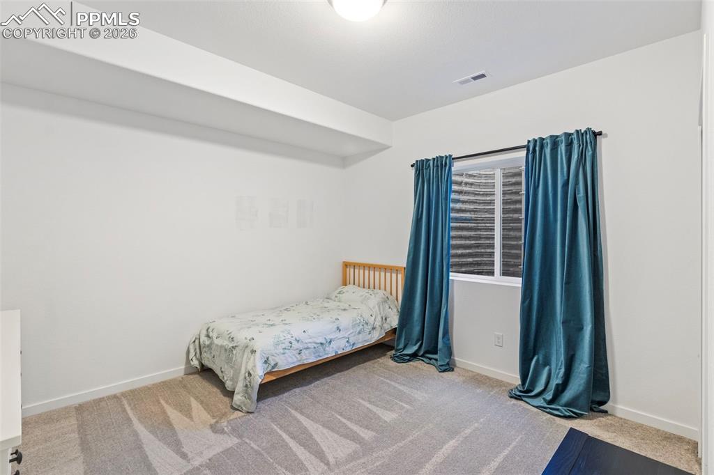Image 29 of 44: basement bedroom