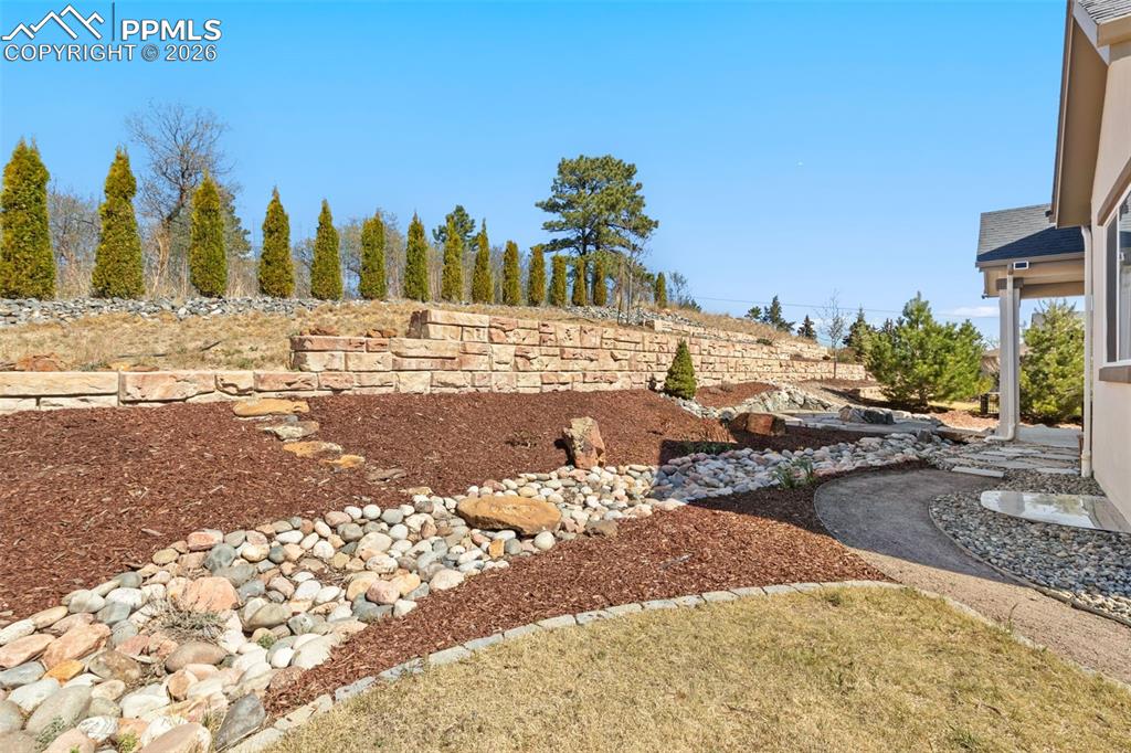 Image 37 of 44: Private backyard w/ fire pit and large grass area