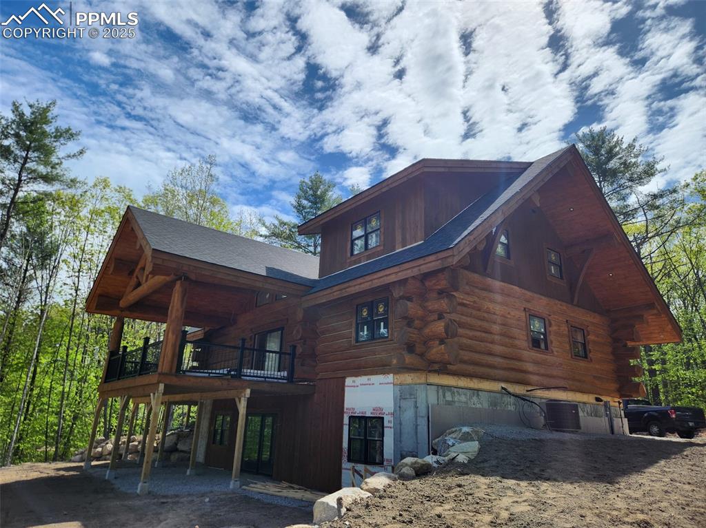 Image 12 of 17: Not the actual property -- View of property exterior featuring log exterior