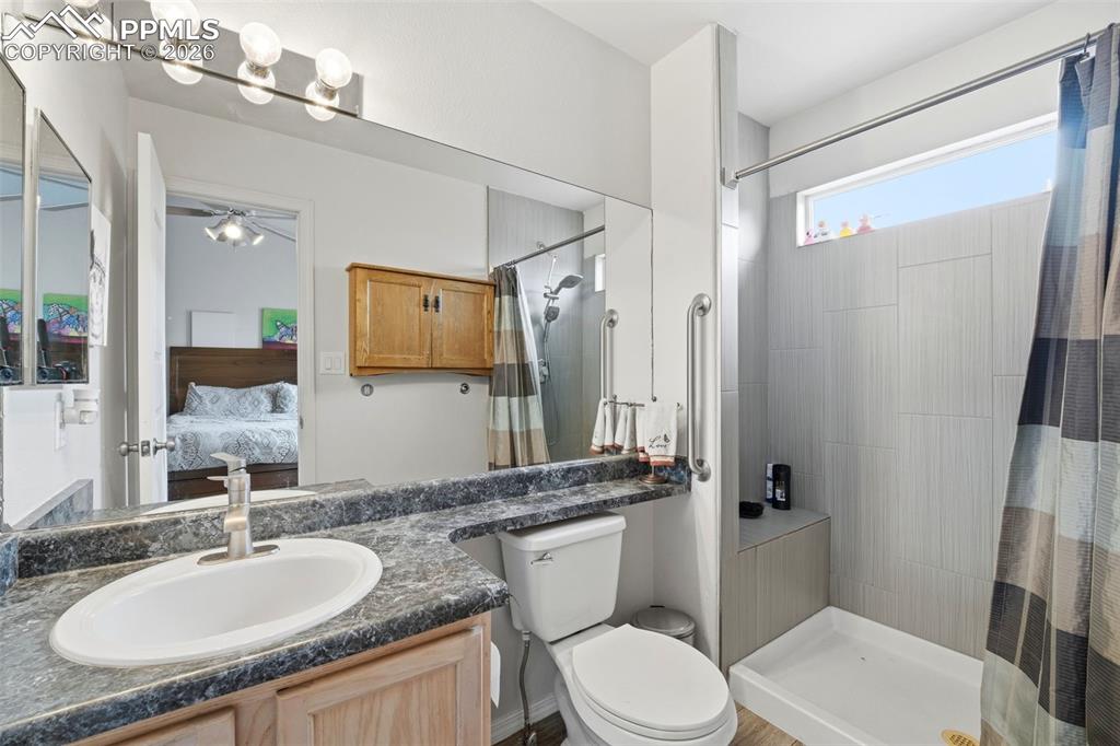 Image 11 of 18: Primary bath with updated shower and tile