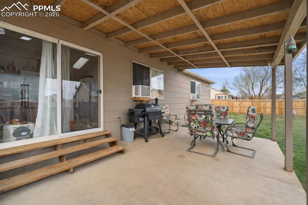 Image 15 of 18: Covered patio ideal for outdoor dining