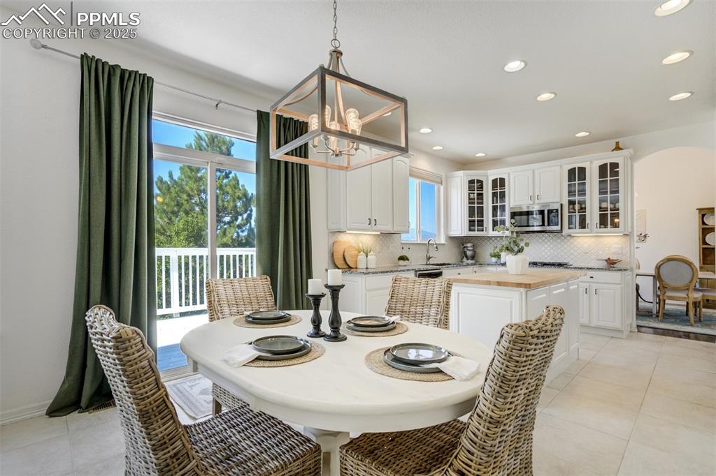 Image 10 of 50: Eat-in dining area just off the kitchen. 
