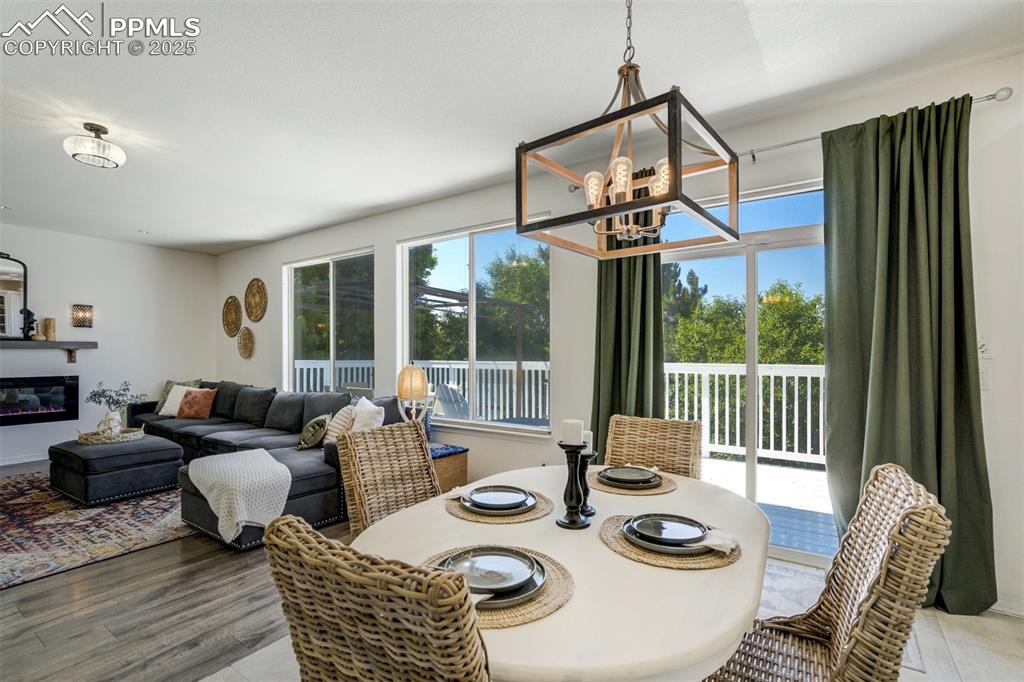 Image 12 of 50: Sliding door leads to the expansive deck. 
