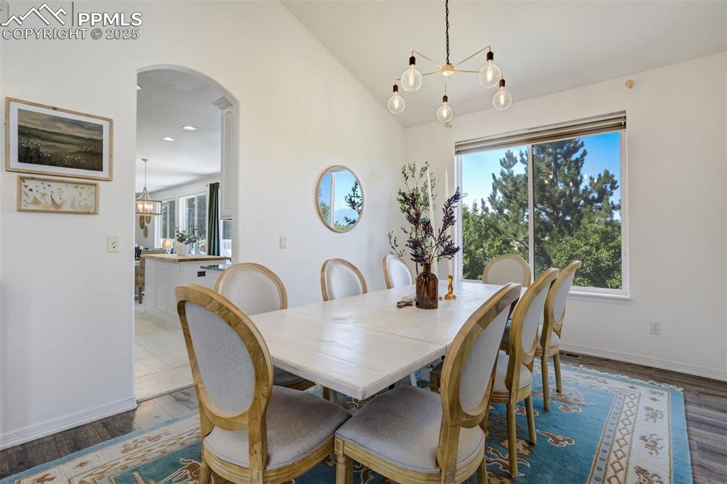 Image 20 of 50: Formal dining room with a view of the backyard. 
