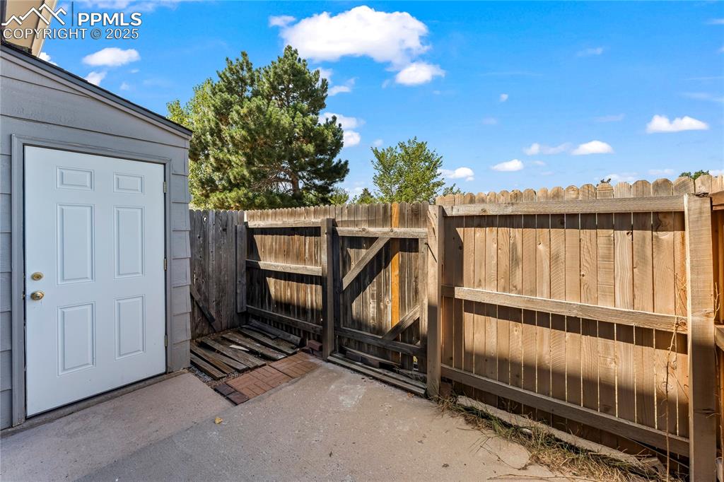 Image 21 of 25: Gate with a patio