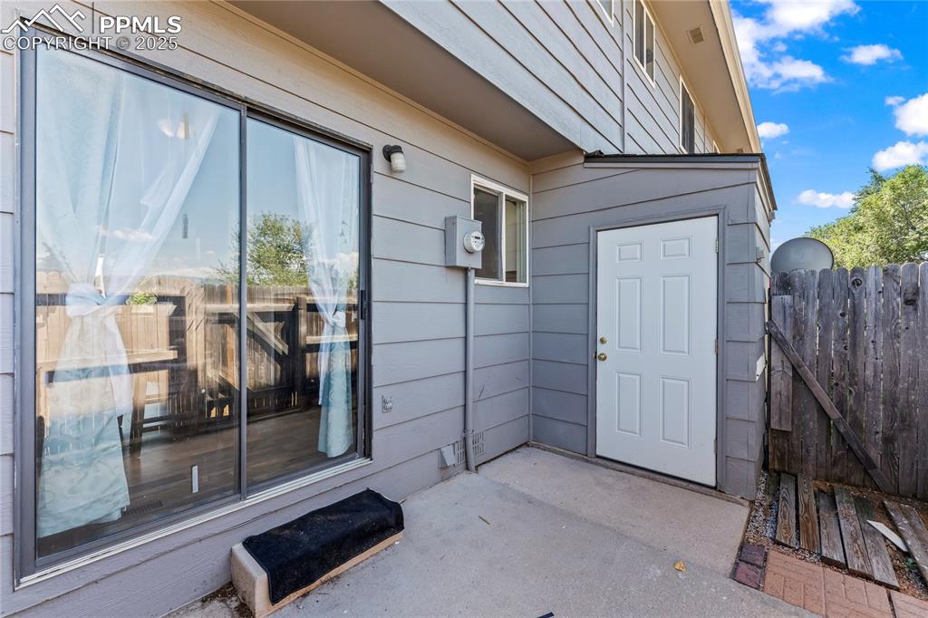 Image 22 of 25: Doorway to property featuring a patio area