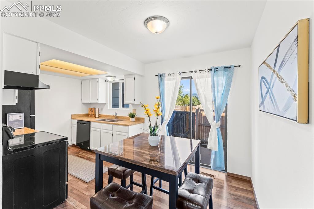 Image 8 of 25: Dining area with light wood-style floors