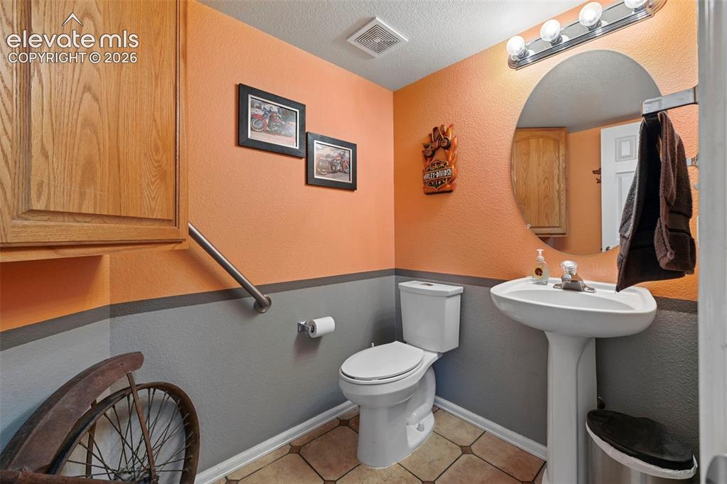 Image 15 of 49: Main level bathroom