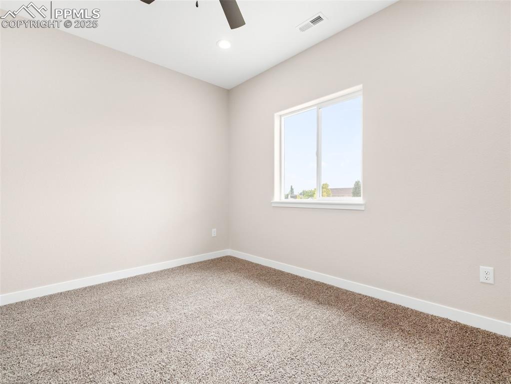 Image 17 of 38: Carpeted spare room with recessed lighting and ceiling fan