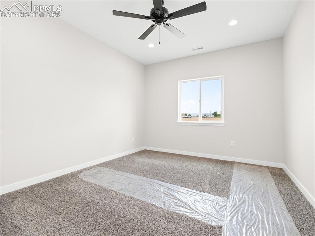 Image 21 of 38: Unfurnished room with carpet, recessed lighting, and a ceiling fan