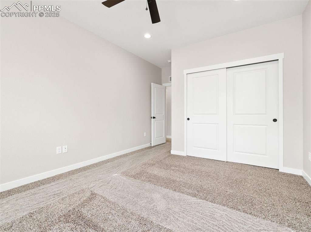 Image 22 of 38: Unfurnished bedroom with carpet, recessed lighting, a closet, and a ceiling