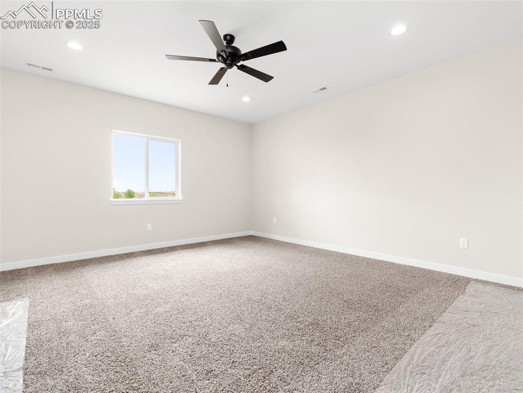 Image 24 of 38: Unfurnished room with light colored carpet, recessed lighting, and a ceilin