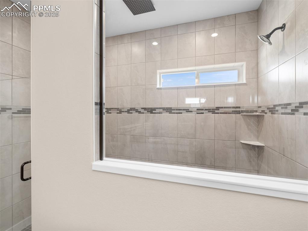 Image 30 of 38: Full bath featuring a stall shower