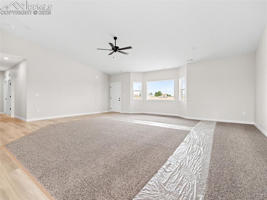 Image 6 of 38: Unfurnished living room featuring recessed lighting and light wood-type flo
