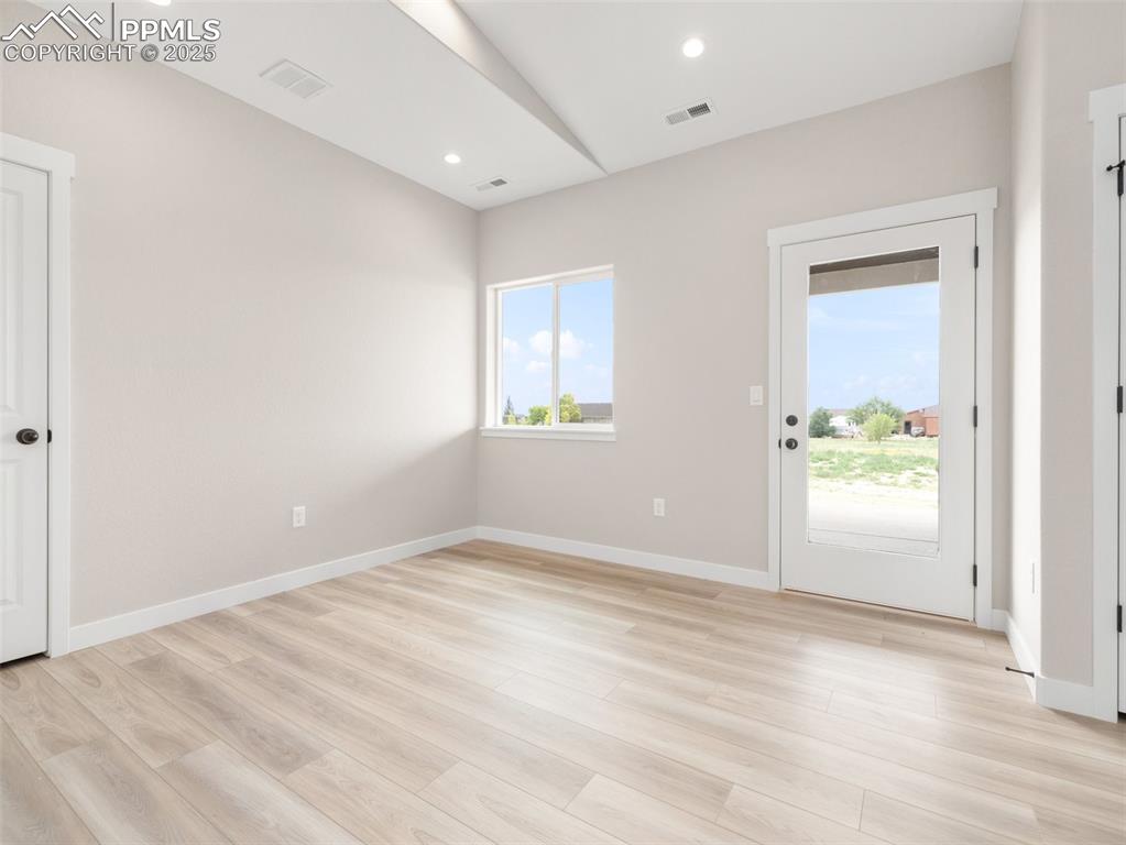 Image 9 of 38: Unfurnished room with light wood-type flooring and recessed lighting