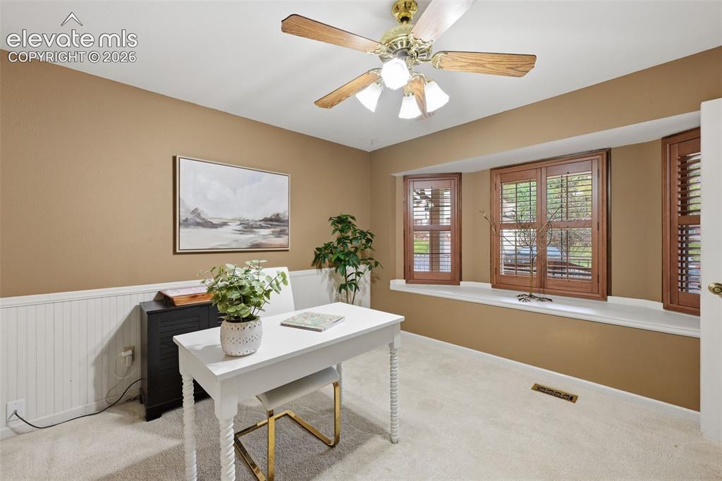 Image 10 of 49: Main floor bedroom/office
