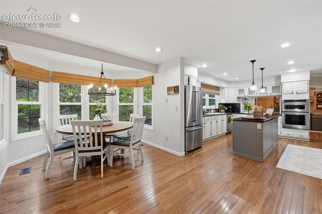 Image 16 of 49: Casual dining area looking towards kitchen