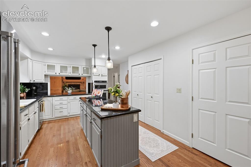 Image 18 of 49: Kitchen double doors to pantry