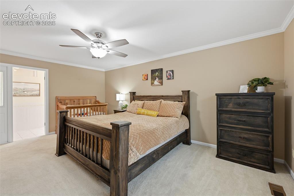 Image 23 of 49: Primary bedroom upper level, with primary bathroom suite and huge walk in c