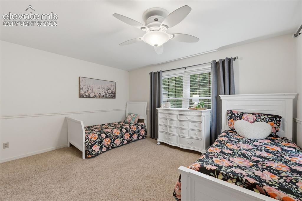 Image 29 of 49: Upper level bedroom on front side of home