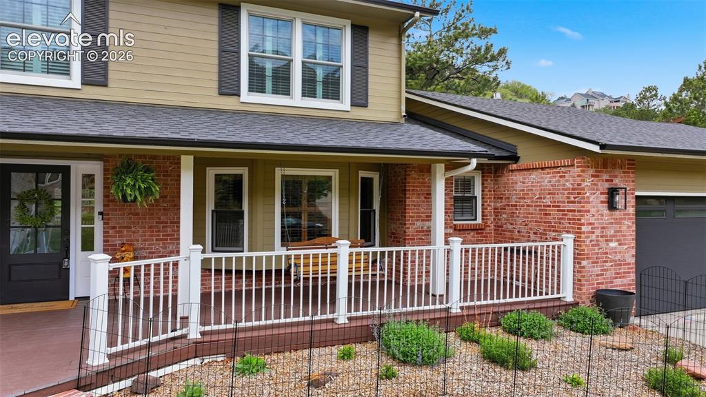 Image 3 of 49: front entry deck large enough for entertaining