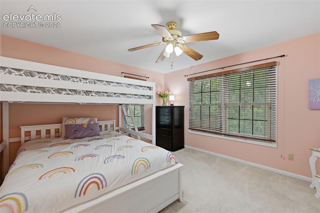 Image 30 of 49: Upper level bedroom on back side of the home.