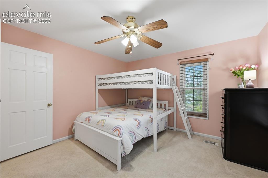Image 31 of 49: Upper level bedroom on back side of the home.