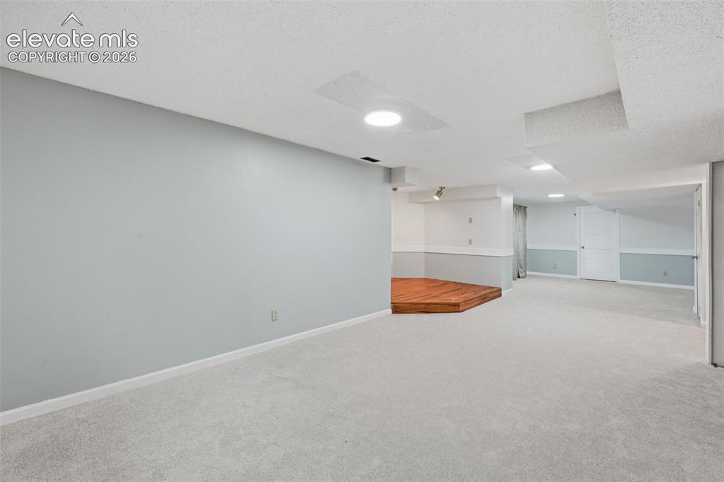 Image 36 of 49: View towards storage room that is HUGE! used for workout room in the past