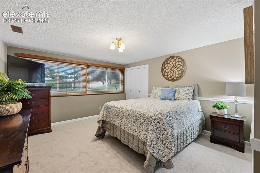 Image 37 of 49: Basement bedroom Garden Level windows offer great light 