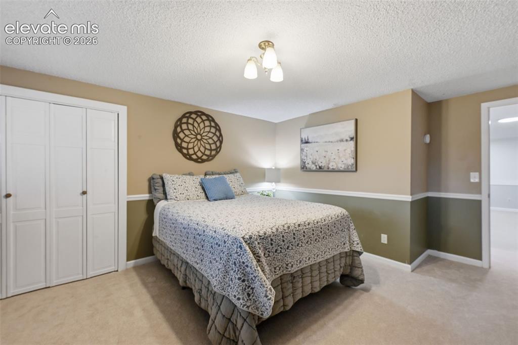 Image 38 of 49: Basement bedroom Garden Level windows offer great light