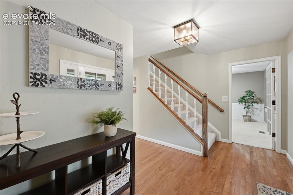 Image 8 of 49: Entry looking towards main floor bedroom/Office