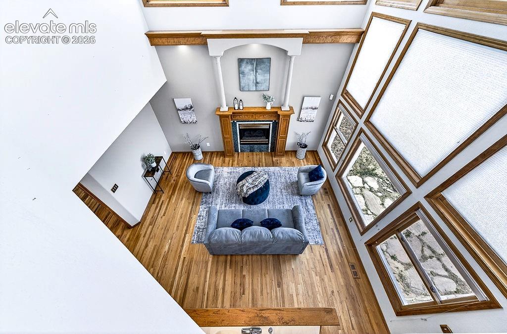 Image 27 of 50: Family room aerial view!  Dramatic wall of windows!