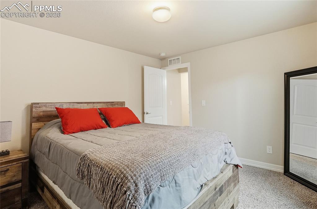 Image 32 of 39: Bedroom