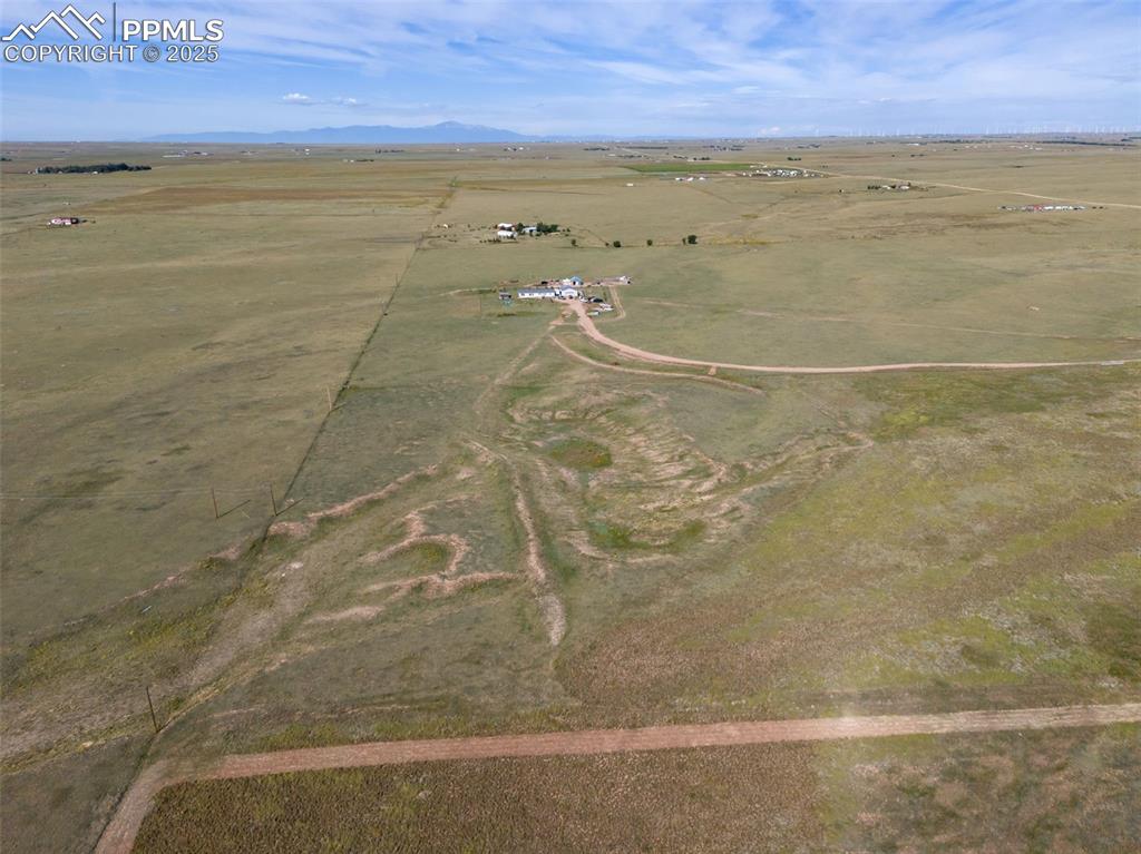 Image 9 of 12: View of property location featuring rural landscape and a mountainous backg