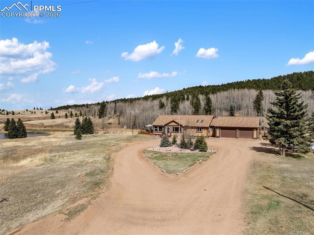 Image 11 of 50: Ariel view of back of property