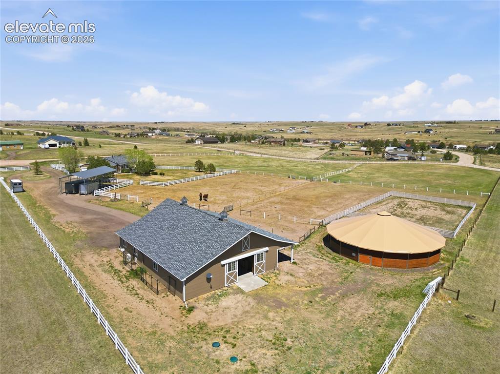 Image 38 of 43: Horse barn and covered round pen