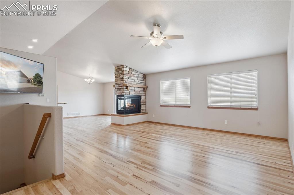 Image 10 of 42: Hardwood throughout open concept main living areas